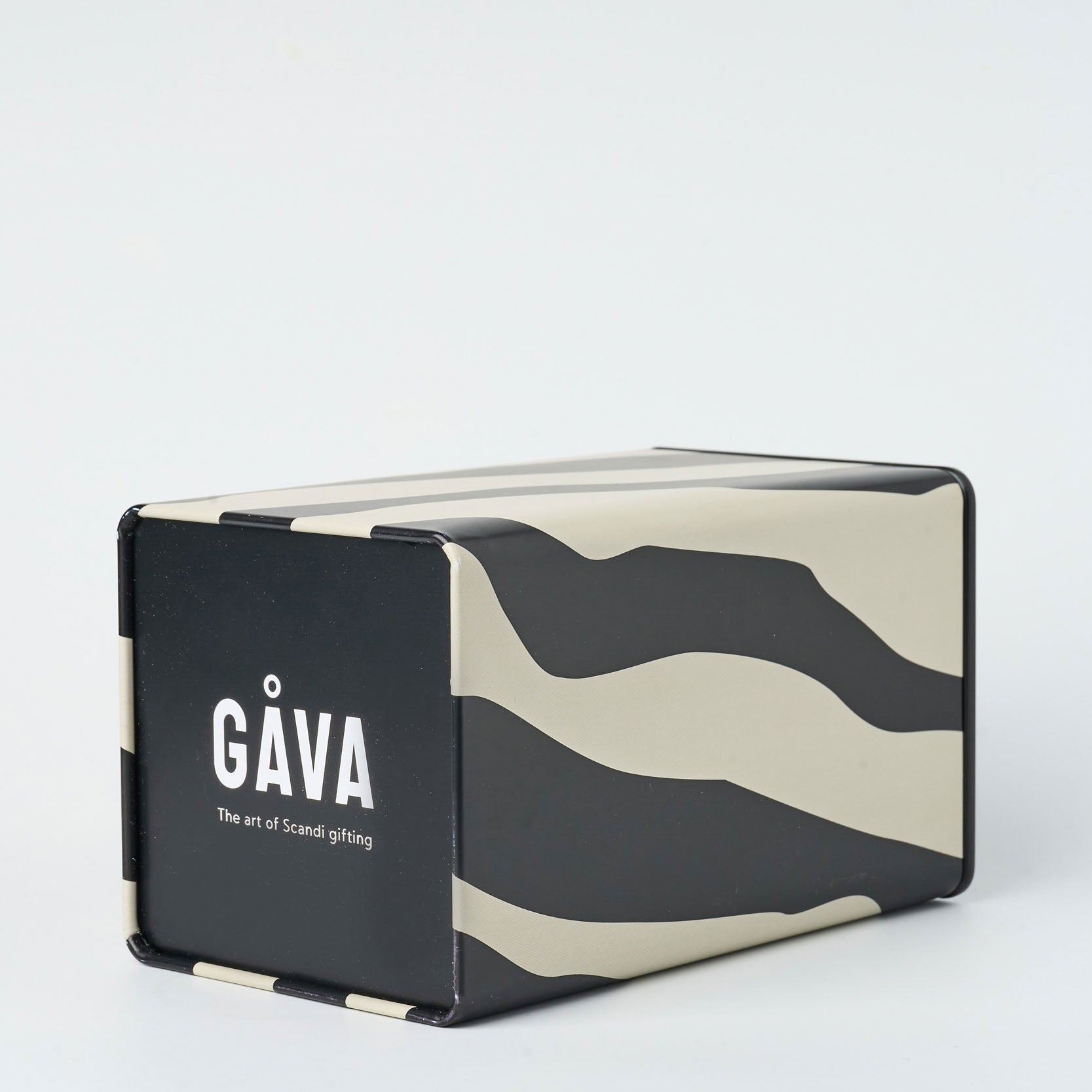 Black and beige patterned box with 'Gäva' branding on the underside, set on a white background